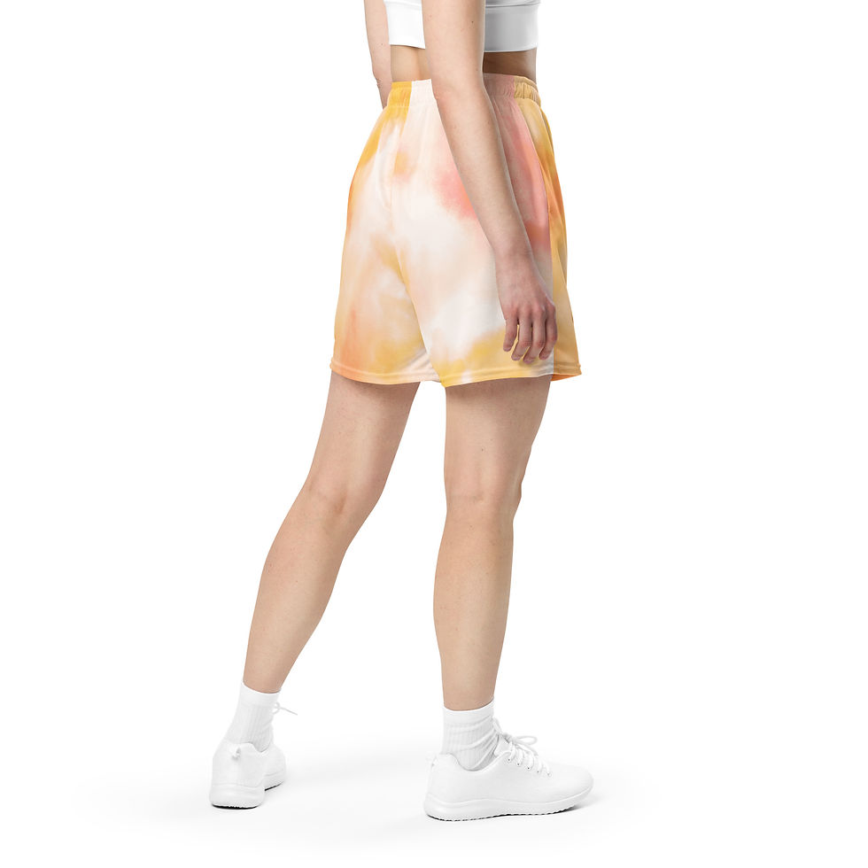 Back view of a woman wearing a Delete Me-designed pair of tie-dye-colored mesh shorts that feature an elastic waistband and moisture-wicking material.