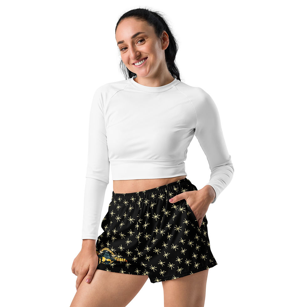 Thumbnail: Woman wearing 2.5” inseemed, black athletic shorts with a bold "Prime Time" graphic featuring a Colorado sports-inspired buffalo head and gold chain.