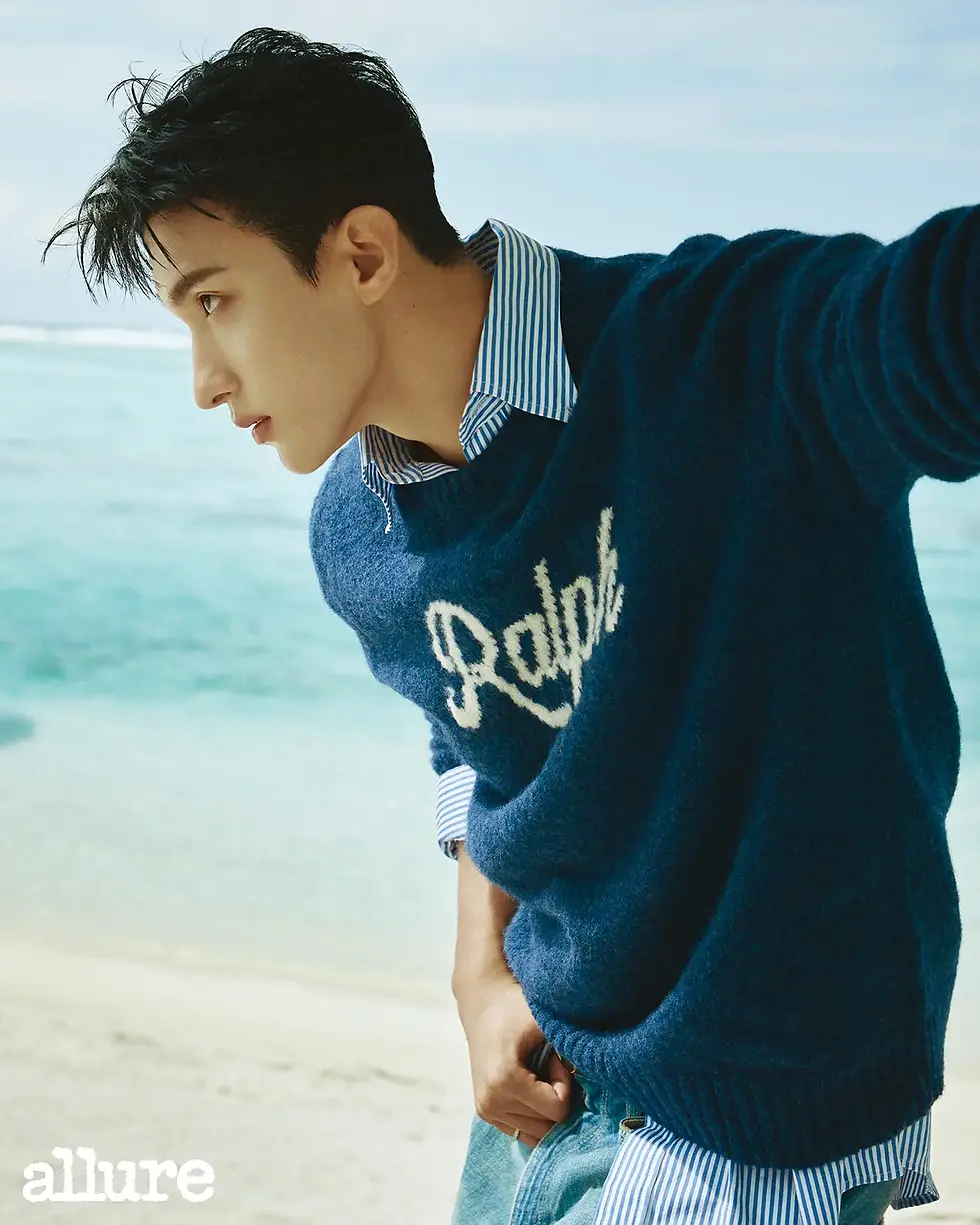 Navy knit, striped shirt, and denim pants are all Polo Ralph Lauren.