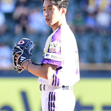 Fully suited up in a baseball uniform, DOKYEOM Returns to the Mound After 2 Years with a Powerful Ceremonial Pitch