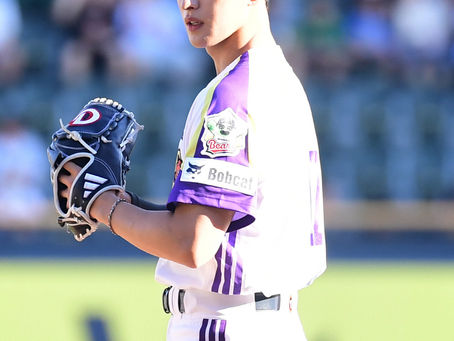 Fully suited up in a baseball uniform, DOKYEOM Returns to the Mound After 2 Years with a Powerful Ceremonial Pitch