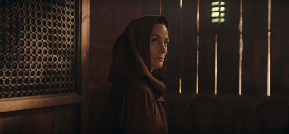 Carrie-Anne Moss as Jedi Master Indara in her Jedi robes.