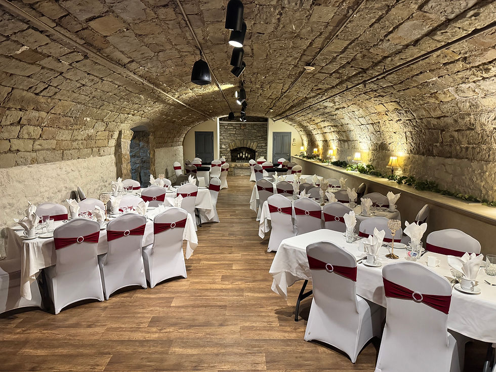 Eye-level view of elegant historic wedding venue interior with wooden beams and soft lighting