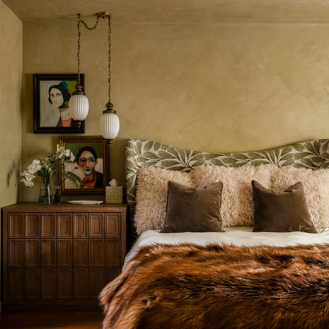 A drenched limewash background with plush textiles, ombre wool drapes, moon grass lighting and unique vintage lighting create the perfect mood. Original artwork, layers of natural colors, oversized night stands and custom closets make this bedroom a sophisticated and timeless retreat. 