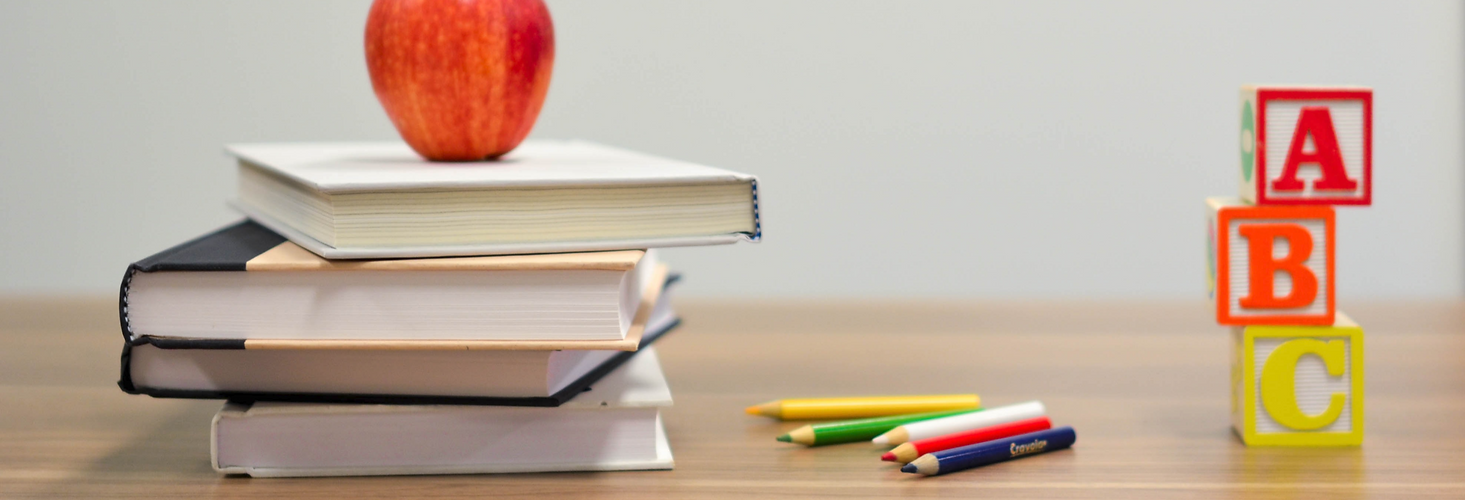 red apple fruit on four pyle books_edite
