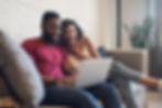 young-couple-spending-time-together-while-using-laptop-home-new-normal-lifestyle-concept.j