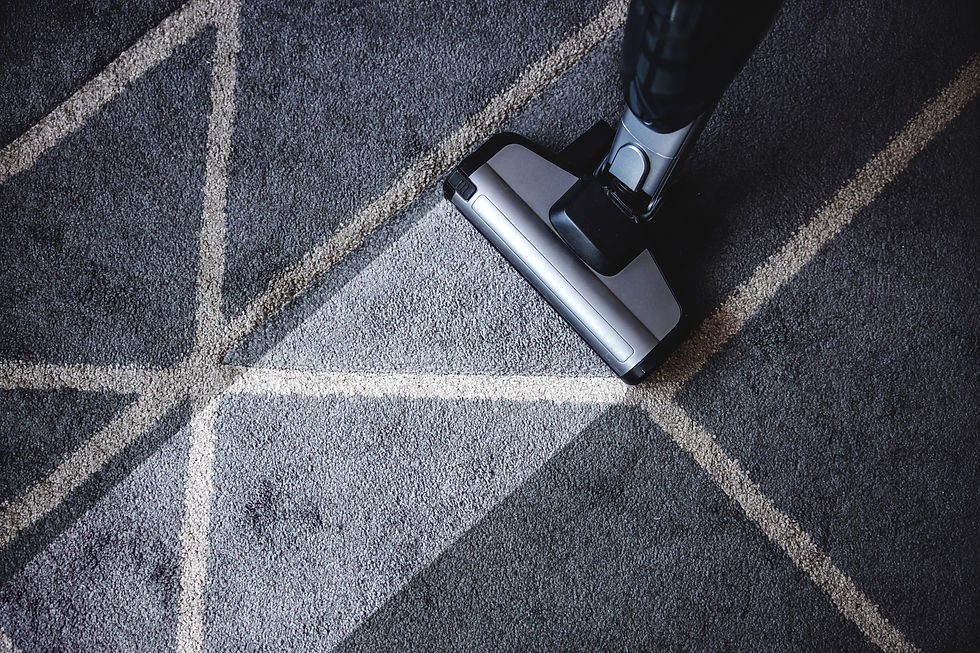 A photo of a vacuum cleaning a carpet.