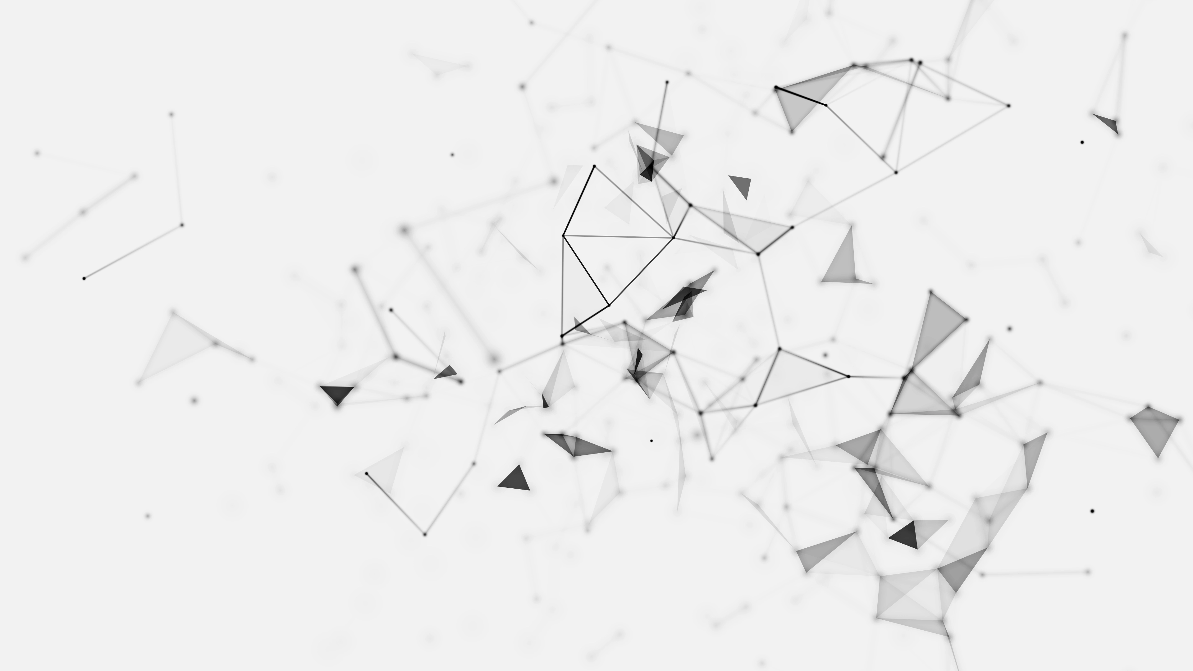 A background image of scattered black polygons.