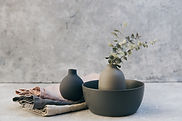 Clay pottery with table linens