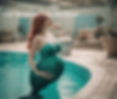 pregnant mermaid in a swimming pool with tail.jpg