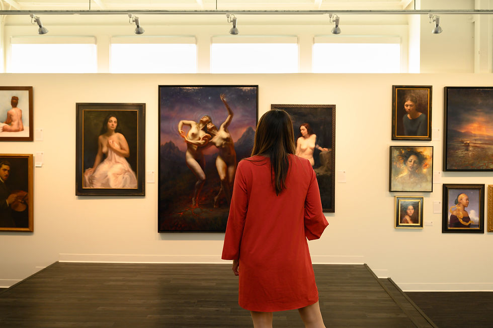 Woman in red dress observes art in a gallery. Paintings of figures and landscapes on white walls, soft light, contemplative mood.