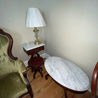Antique tables at estate sale in Augusta, Ga