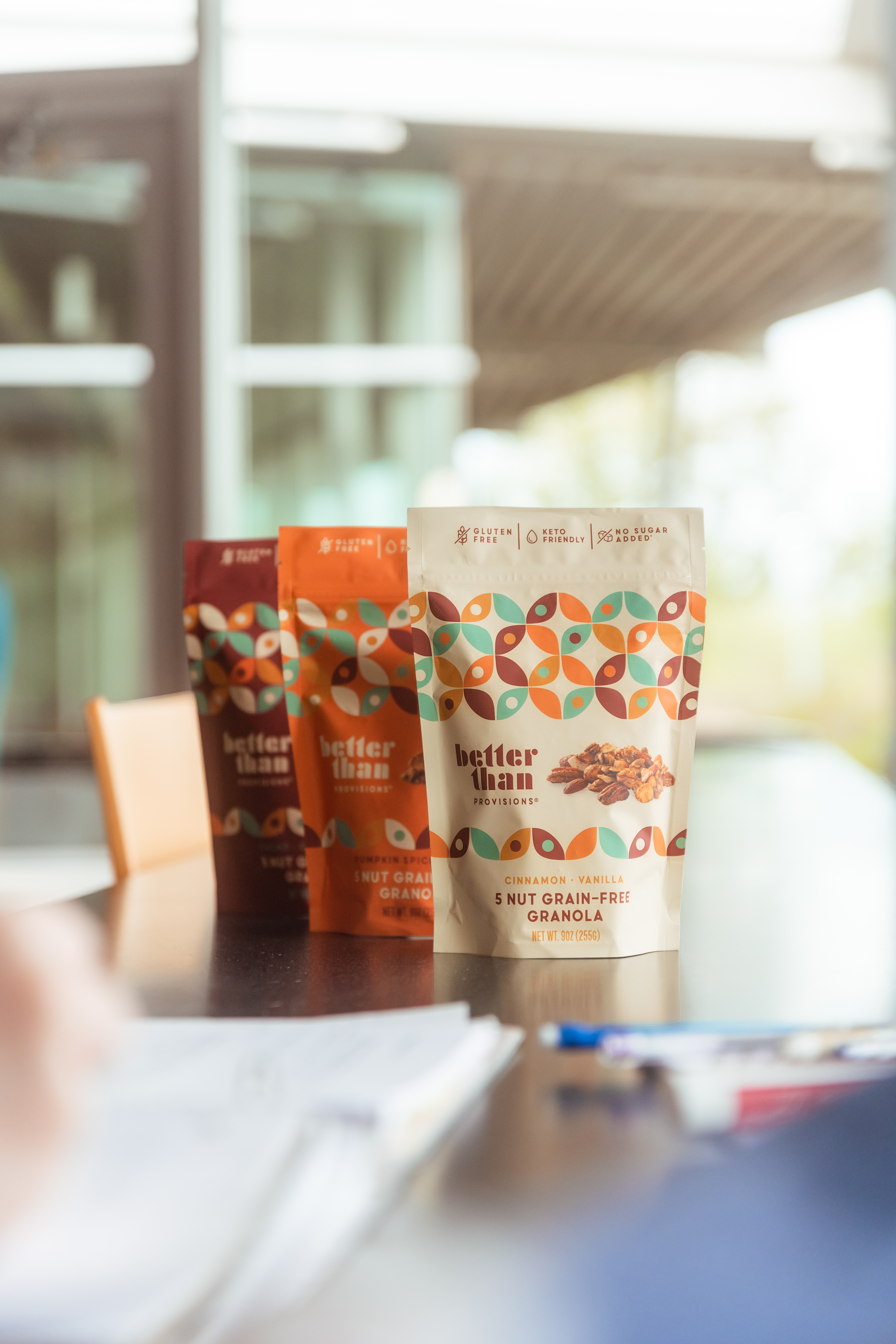 Three flavors of Better Than Provisions granola lined up as perfect back-to-school snacks.
