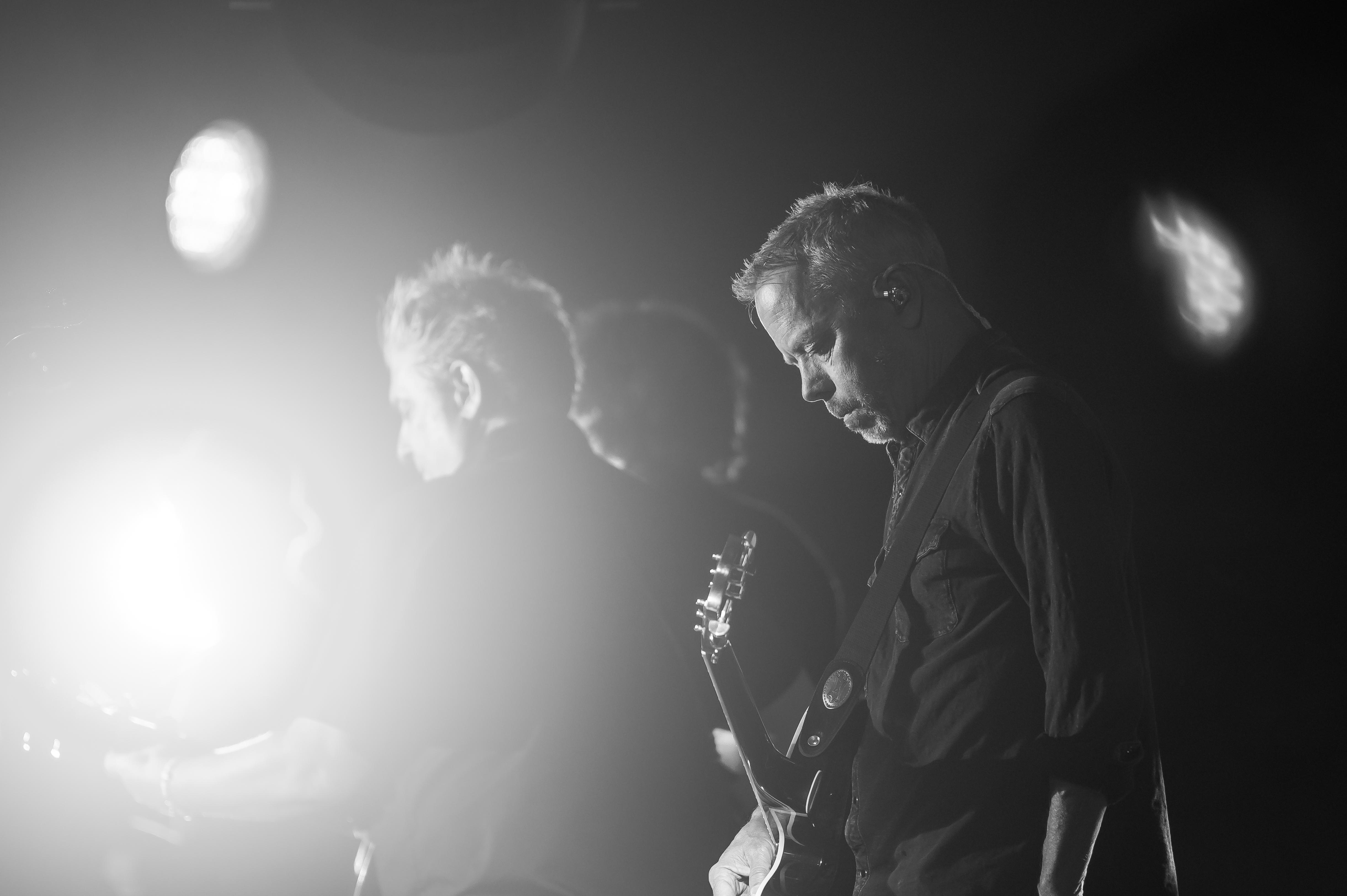 Band member pausing before next song at Coca-Cola private concert during 2024 Final Four in Scottsdale hangar.
