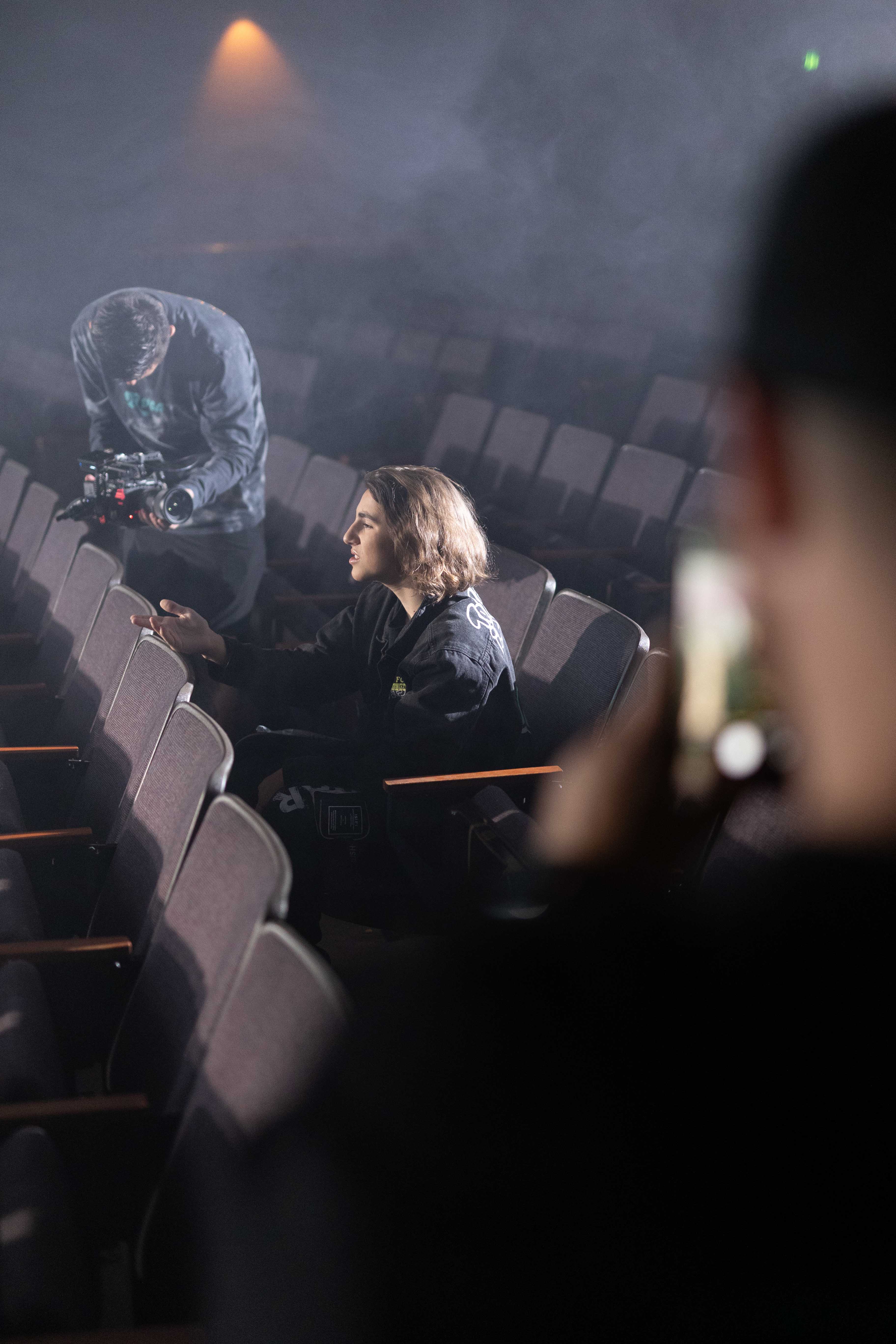 Behind-the-scenes photo of Dominique Ilie filming a music video for his song "Complicated".
