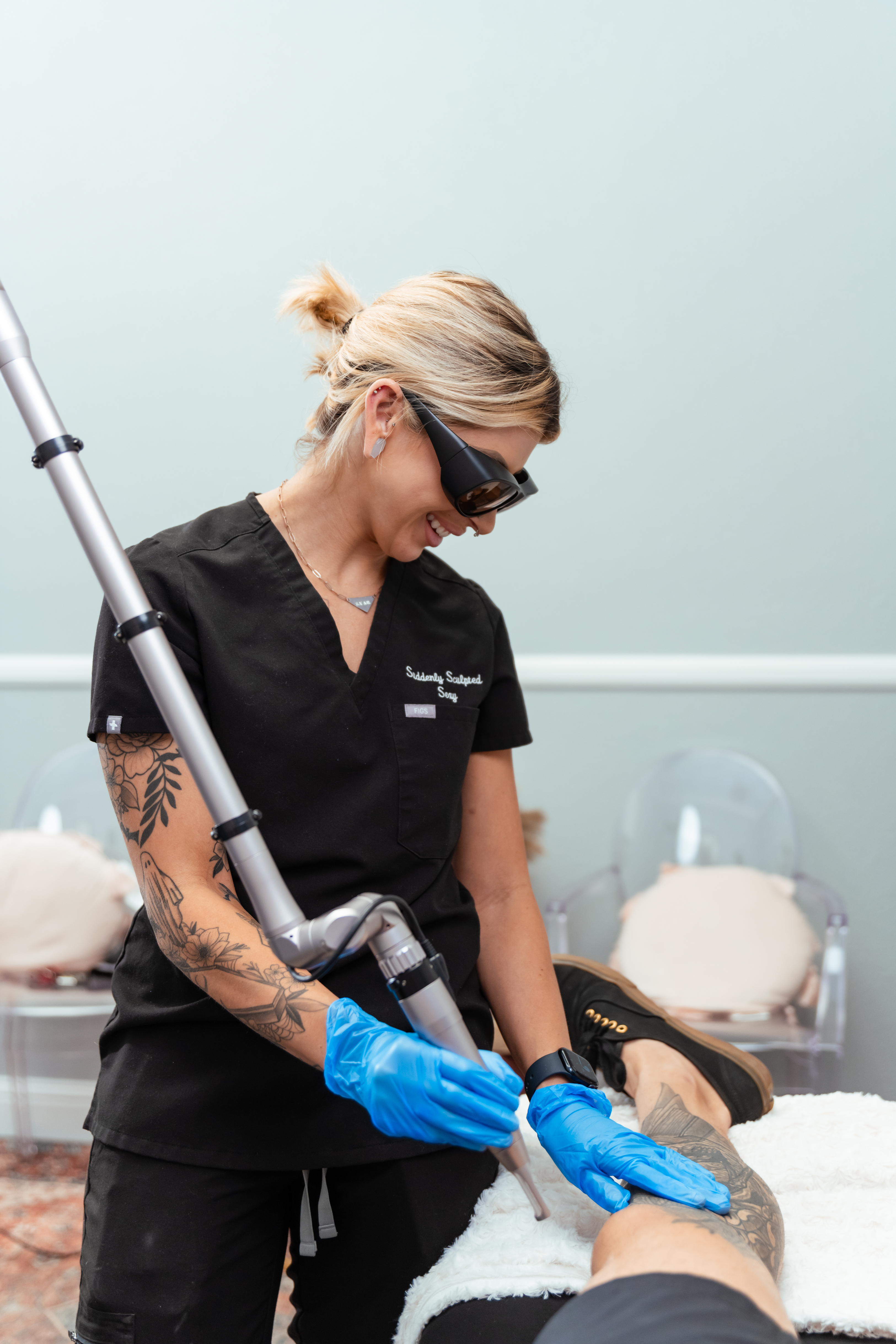 Suddenly Sculpted and Sexy tattoo removal technician performing services on patient, in Arizona.
