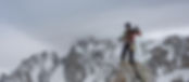 A mountain guide coiling a rope
