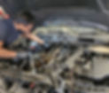 mechanic working on engine