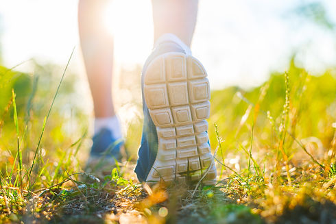 person walking on grass