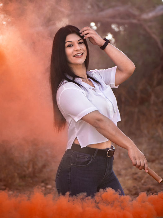 Woman portrait with orange smoke