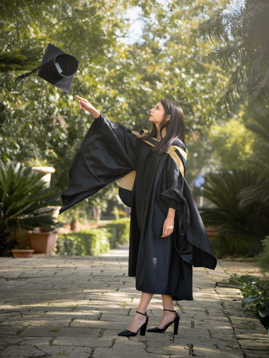 Graduation photo throwing hat