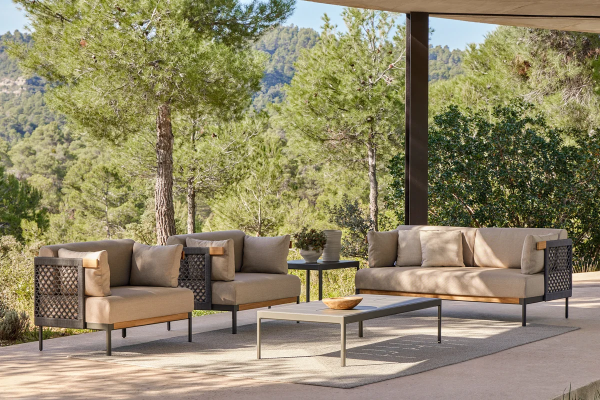 Outdoor rug anchoring a seating area, adding warmth and defining the space.