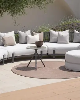 MICHELANGELO Outdoor Rug – Shown under outdoor furniture in a high-end residential setting.