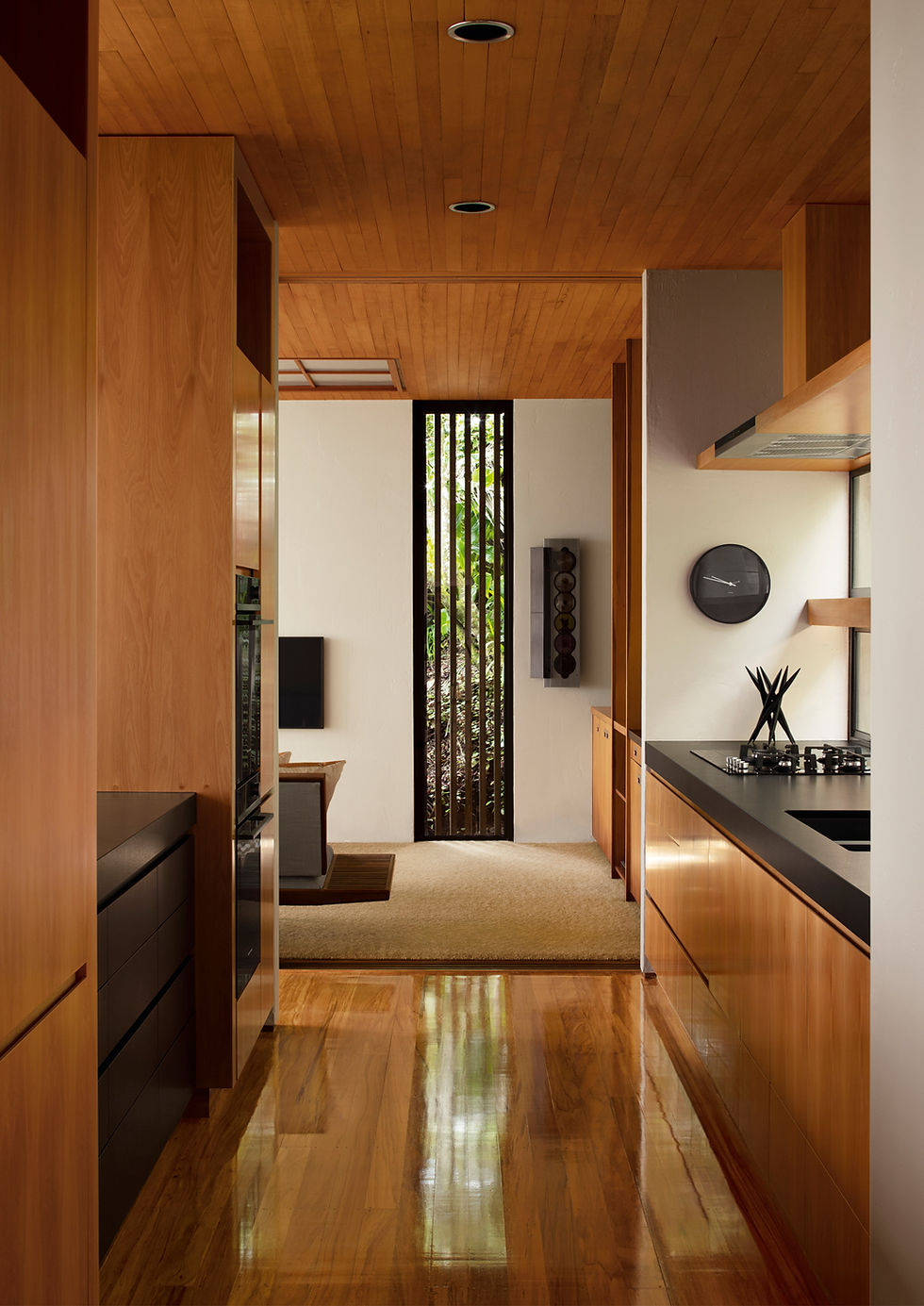 Custom timber kitchen cabinetry and integrated storage by Essex Cabinetmakers