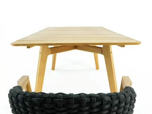 KNIT rectangular outdoor dining table in teak photographed in studio setting