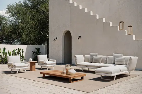 ASTRO Outdoor Lantern – Styled beside outdoor lounge furniture in a high-end residential setting.