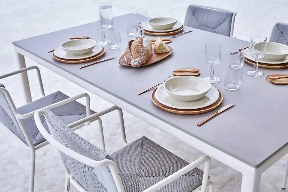 Outdoor dining table and chairs from European brands, designed for various price points.