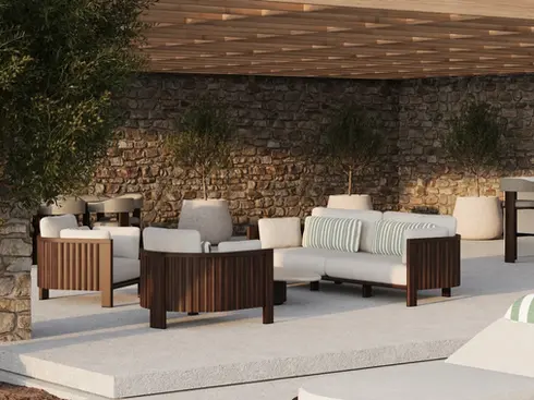 ZANTE Armchair in a luxury residential outdoor lounge, showcasing refined seating and sculptural detailing.