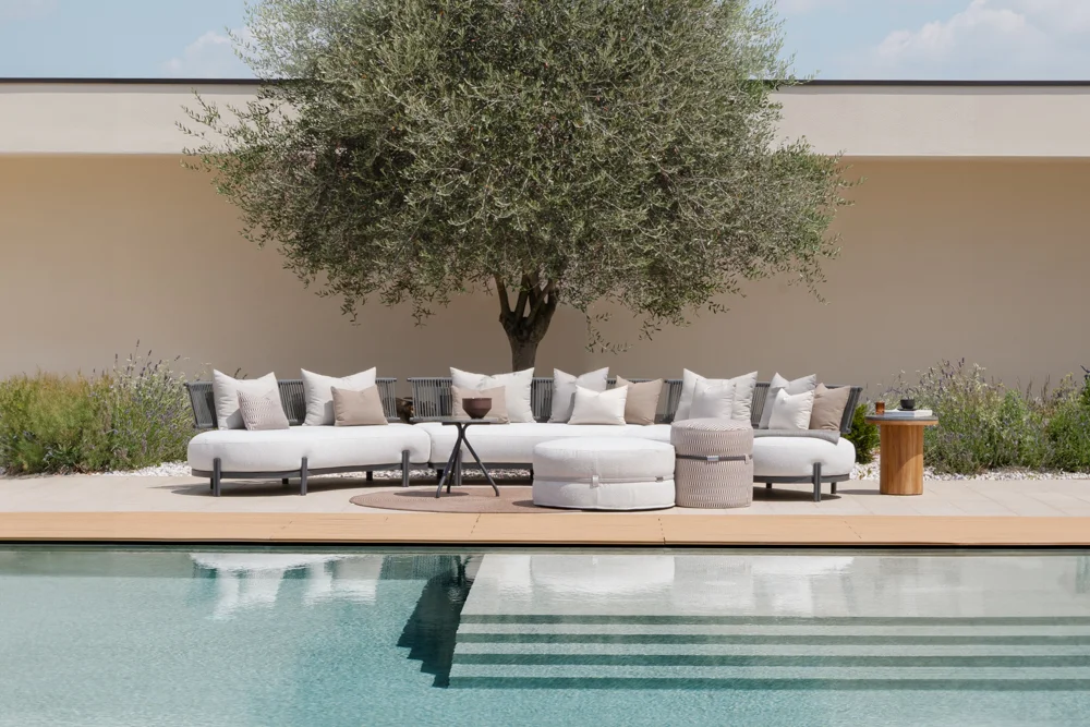 Loto outdoor sofa nz, positioned poolside, perfect for relaxing in premium NZ outdoor spaces.