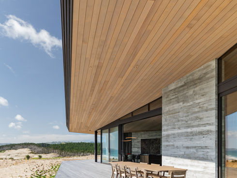 POINT Paralel outdoor dining furniture beneath the timber roof at Whaitere