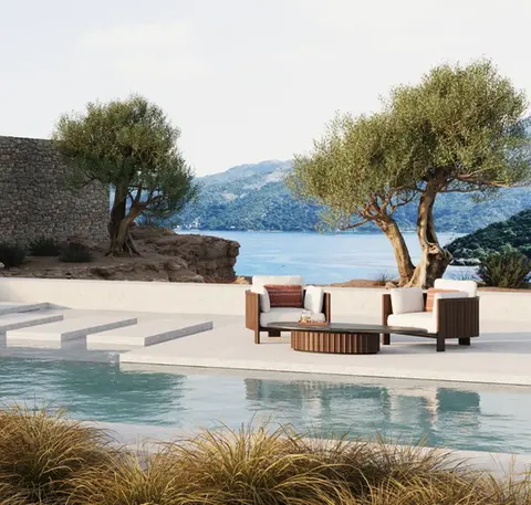 ZANTE Armchairs in a luxury residential outdoor lounge, showcasing refined seating and sculptural detailing.