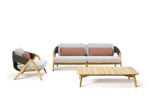 KNIT 3-seater outdoor sofa, armchair, and coffee table in teak and woven rope photographed in studio setting