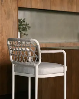 Close up detail of CURIO Bar Stool placed by kitchen, blending with contemporary decor.