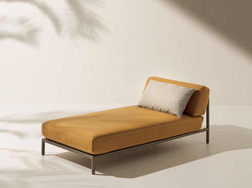 ETHIMO LODGE outdoor daybed in studio setting with mustard cushion
