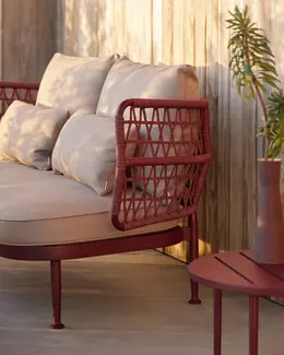 CURIO 2-Seater Sofa featured in a minimalist outdoor seating arrangement.
