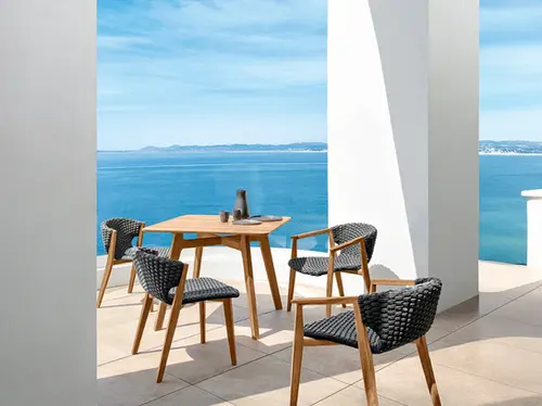 KNIT square outdoor dining table in teak with sea views