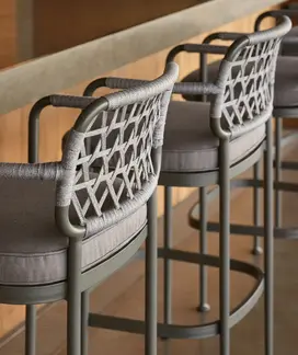 CURIO Bar Stools placed by kitchen, blending with contemporary decor.