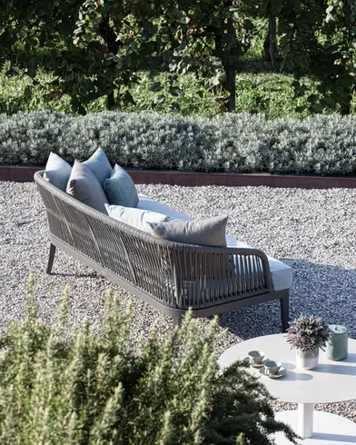 DREAM outdoor sofa with hand‑woven rope backrest, powder‑coated aluminium frame, and plush quick‑dry cushions.