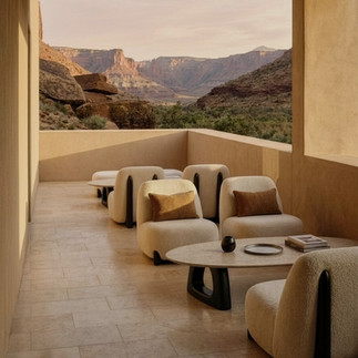Coco Wolf Paloma lounge chairs and low tables on a sheltered terrace overlooking a warm desert landscape.