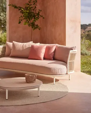 Amba Sofa with woven backrest in Mineral White finish and weatherproof cushions.