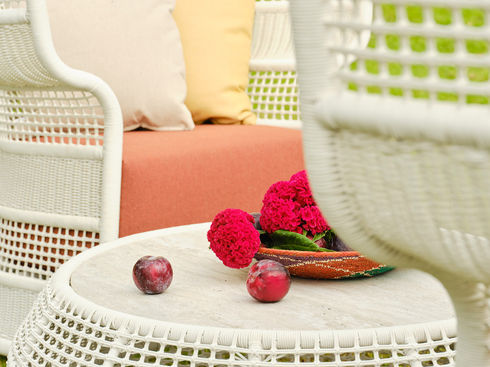 Close-up of the ESCALA Coffee Table with woven fibre base