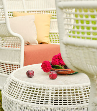 Close-up of the ESCALA Coffee Table with woven fibre base