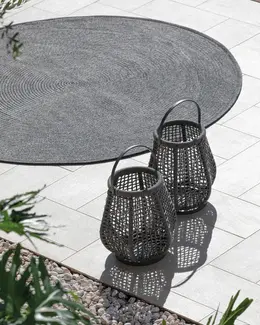 MICHELANGELO Outdoor Rug – Shown under outdoor furniture in a high-end residential setting.