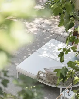 DREAM outdoor daybed pair with rope‑woven backrests, powder‑coated aluminium frames, and deep cushioned seating.