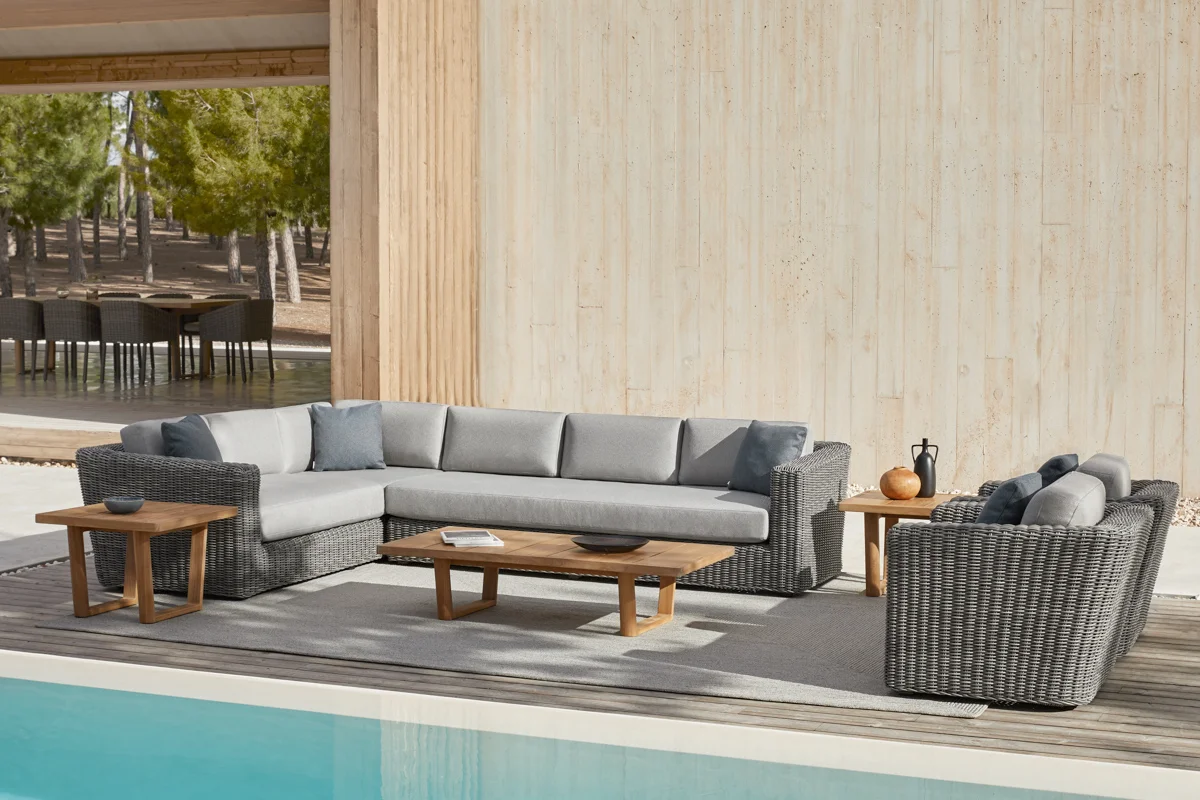 Outdoor rug anchoring a seating area, adding warmth and defining the space.