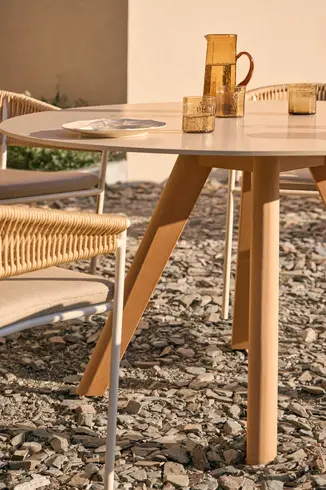 KUBIK round outdoor dining table with central TechTeak base and durable tabletop options